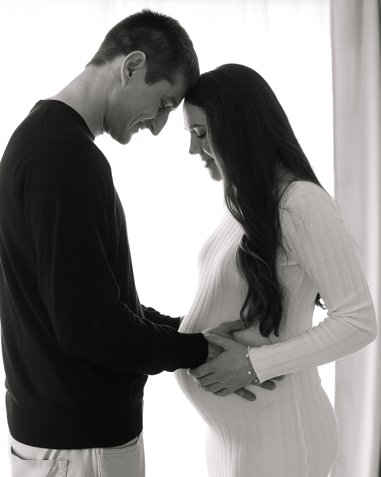 couple posing during studio maternity session