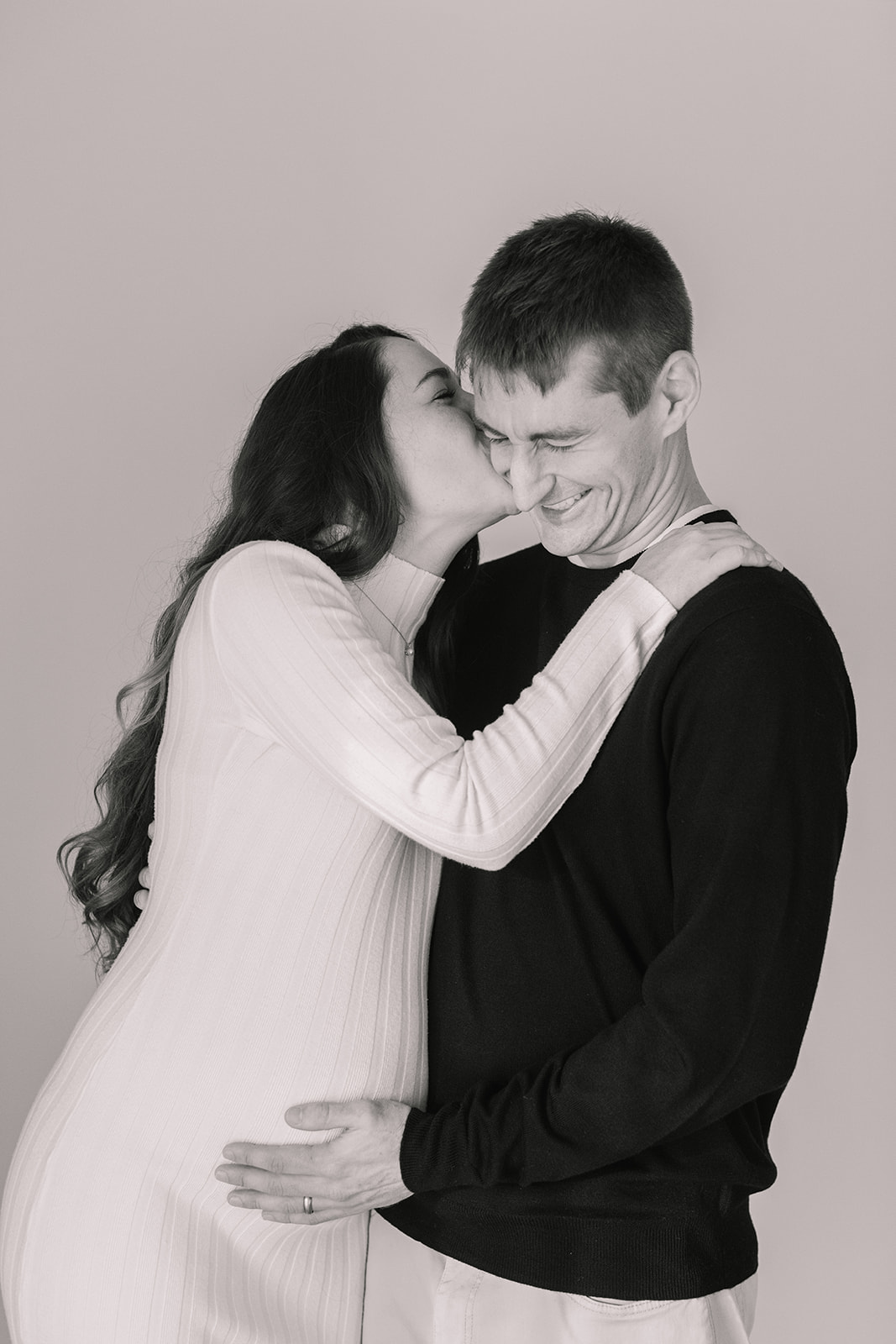 couple posing during studio maternity session