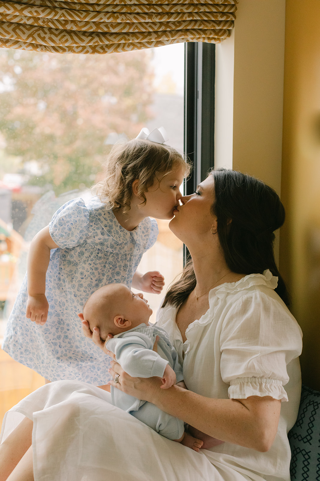 mama with her two children: toddler daughter and newborn son