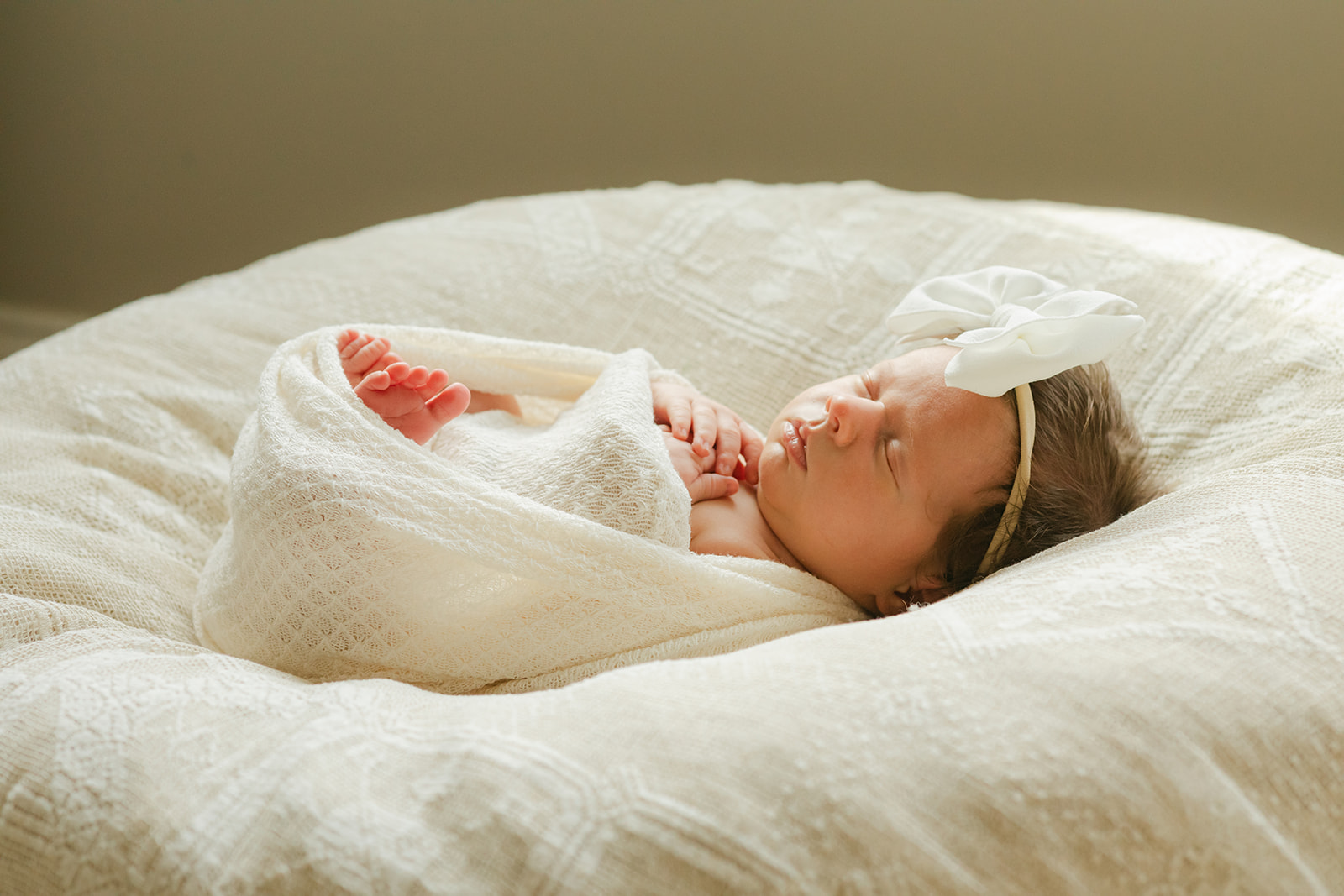 sleepy baby girl. newborn session in nursery