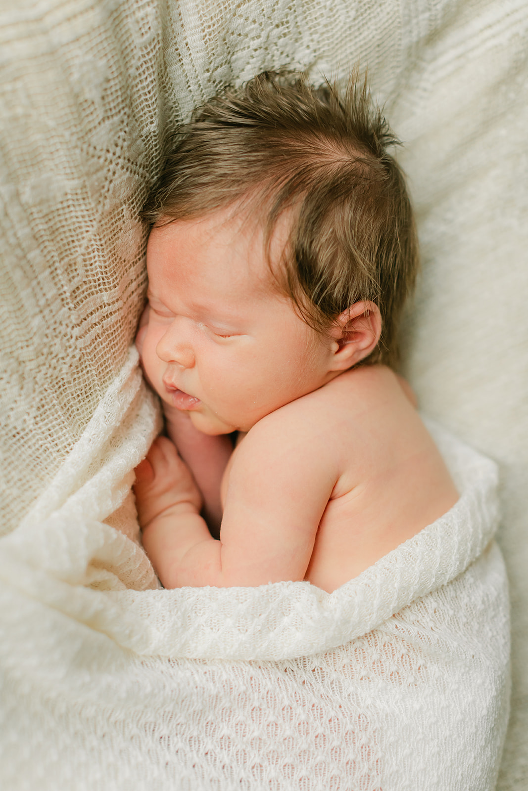 sleepy newborn baby girl