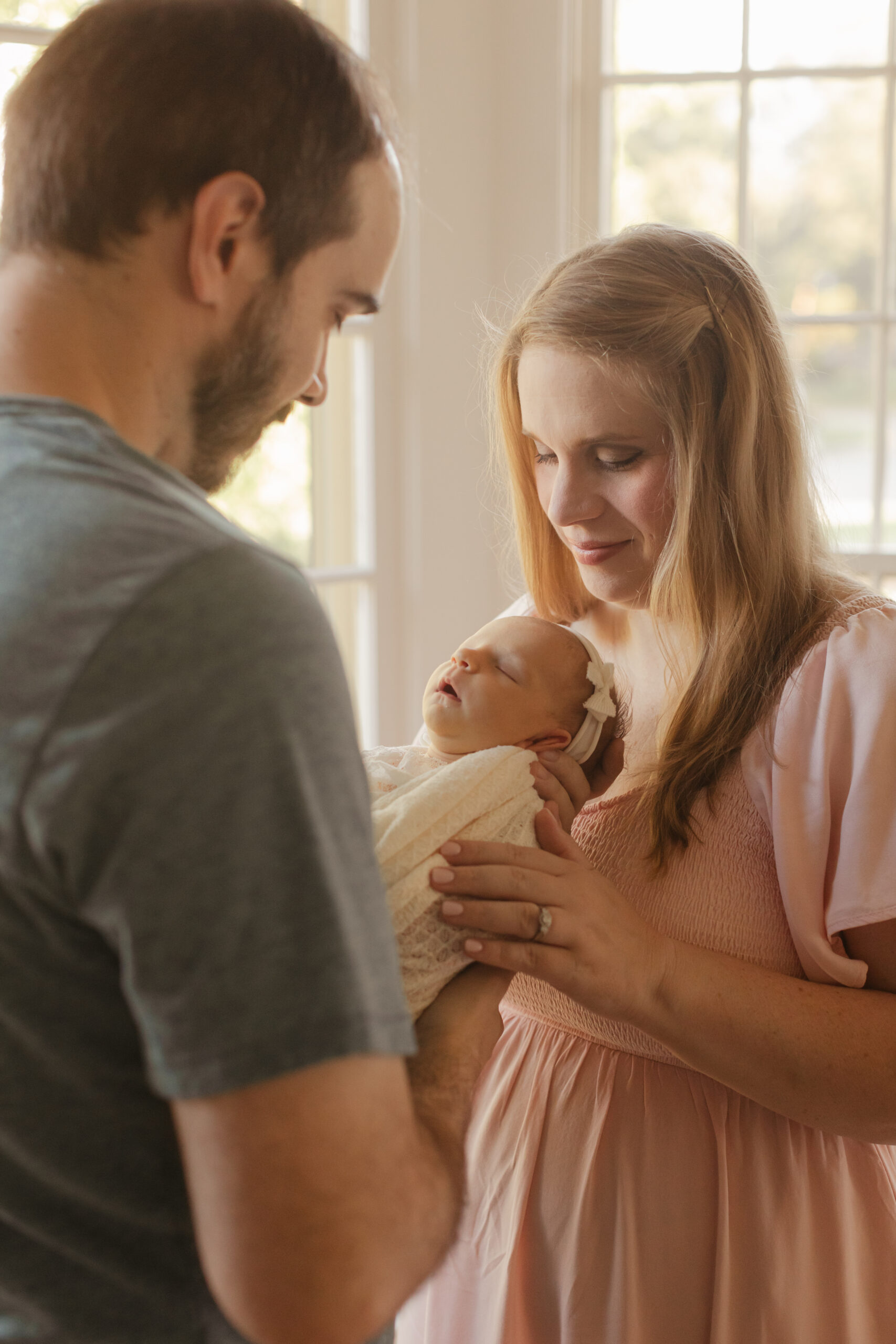 parents with newborn daughter