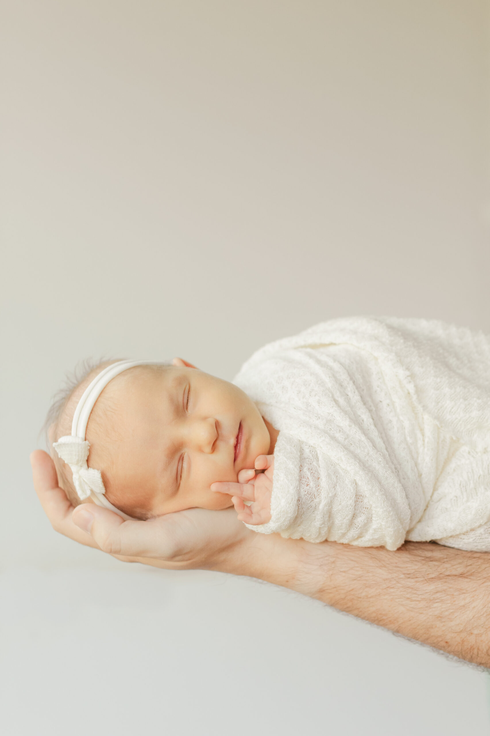 sleepy newborn baby girl