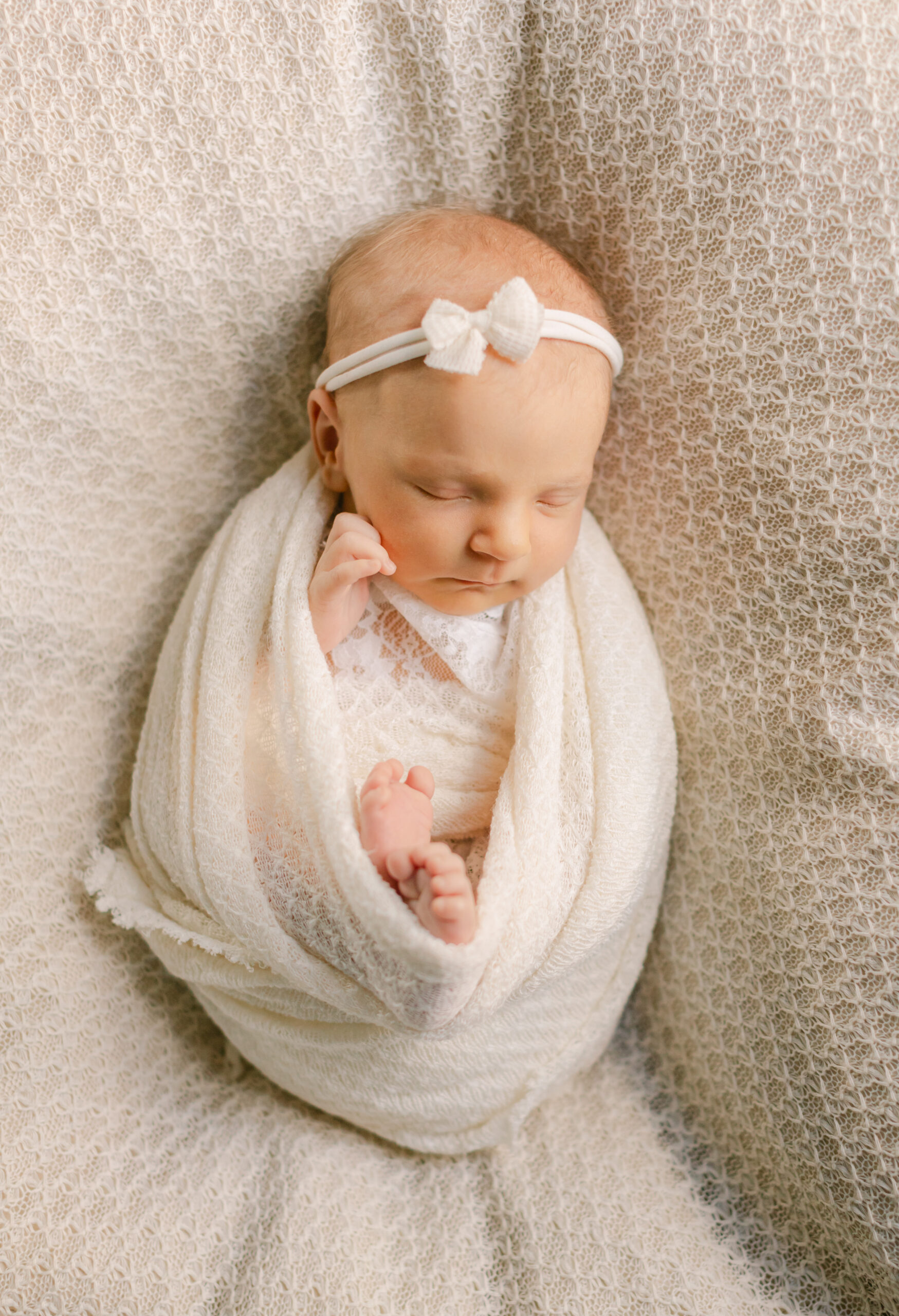 sleepy newborn baby girl 