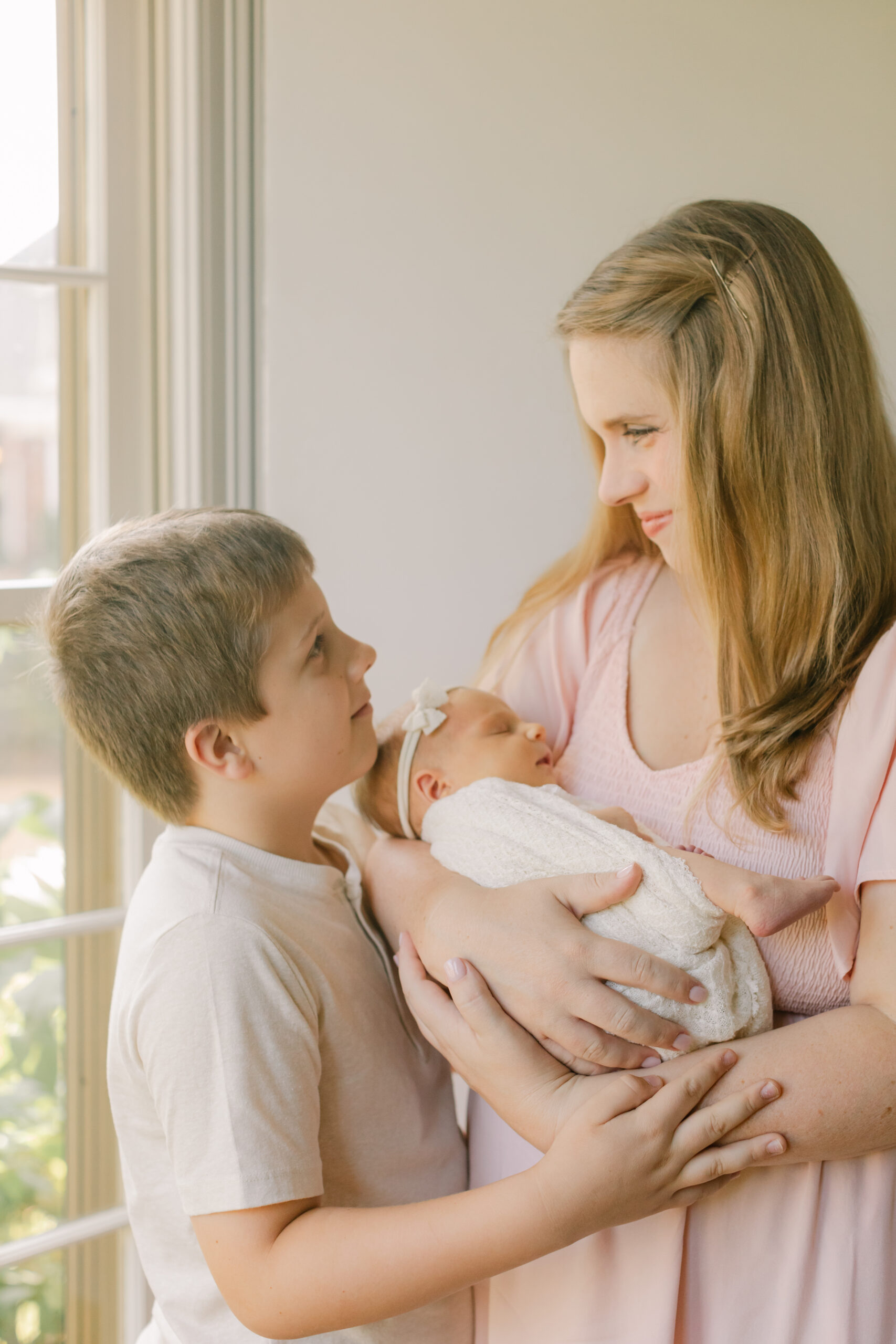 mama with newborn daughter and oldest son