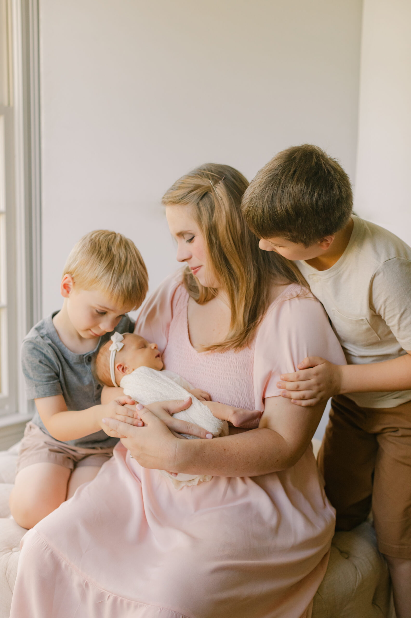 mama with her three children (two boys and newborn daughter)