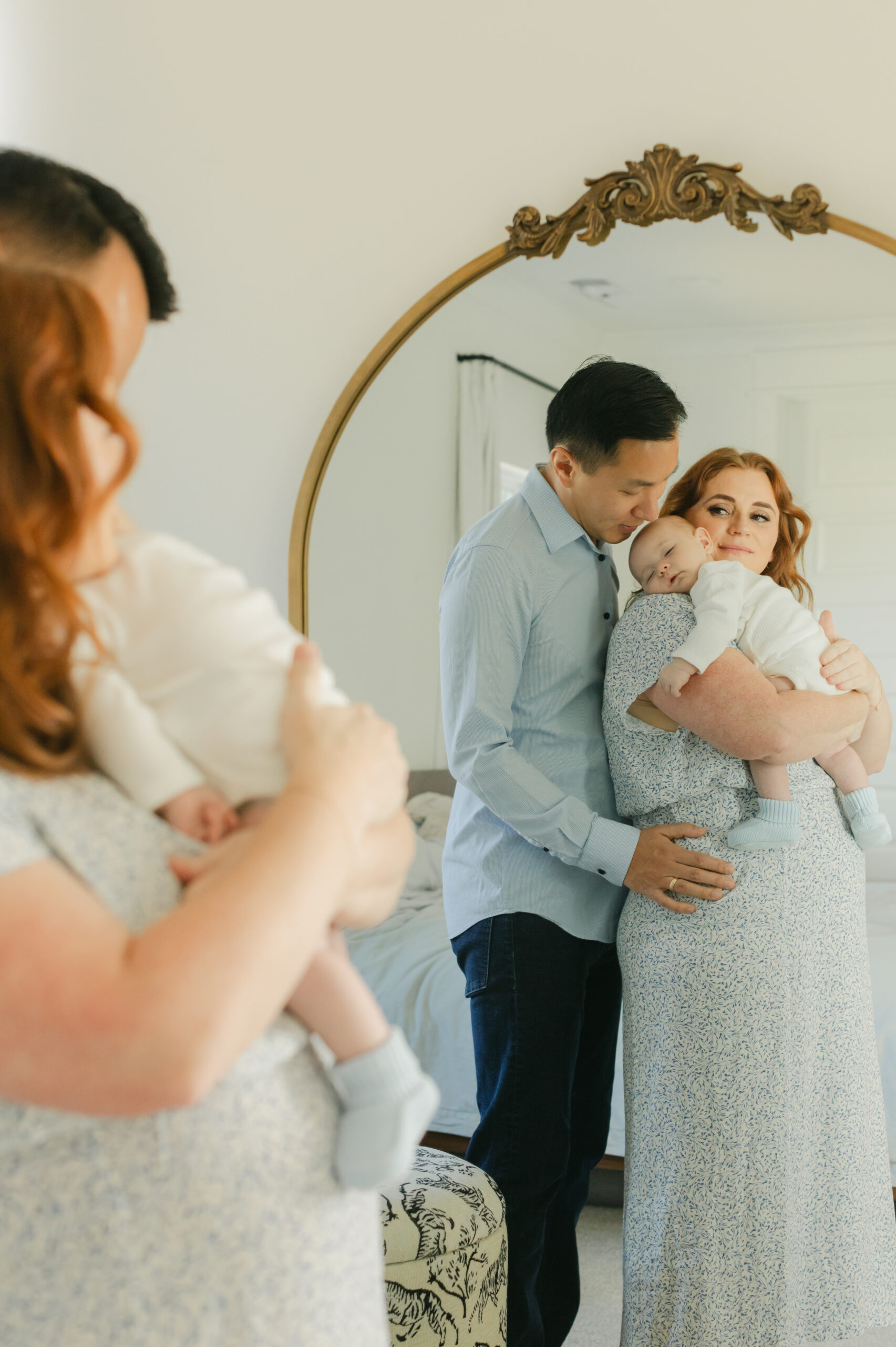 parents in home with newborn son