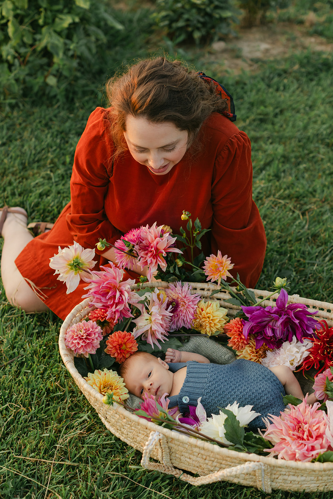 mom with newborn baby boy in backyard