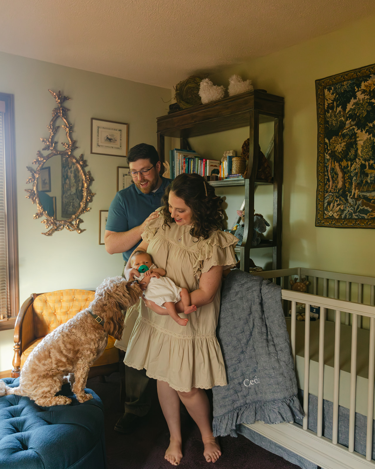 parents with newborn baby boy backyard photo