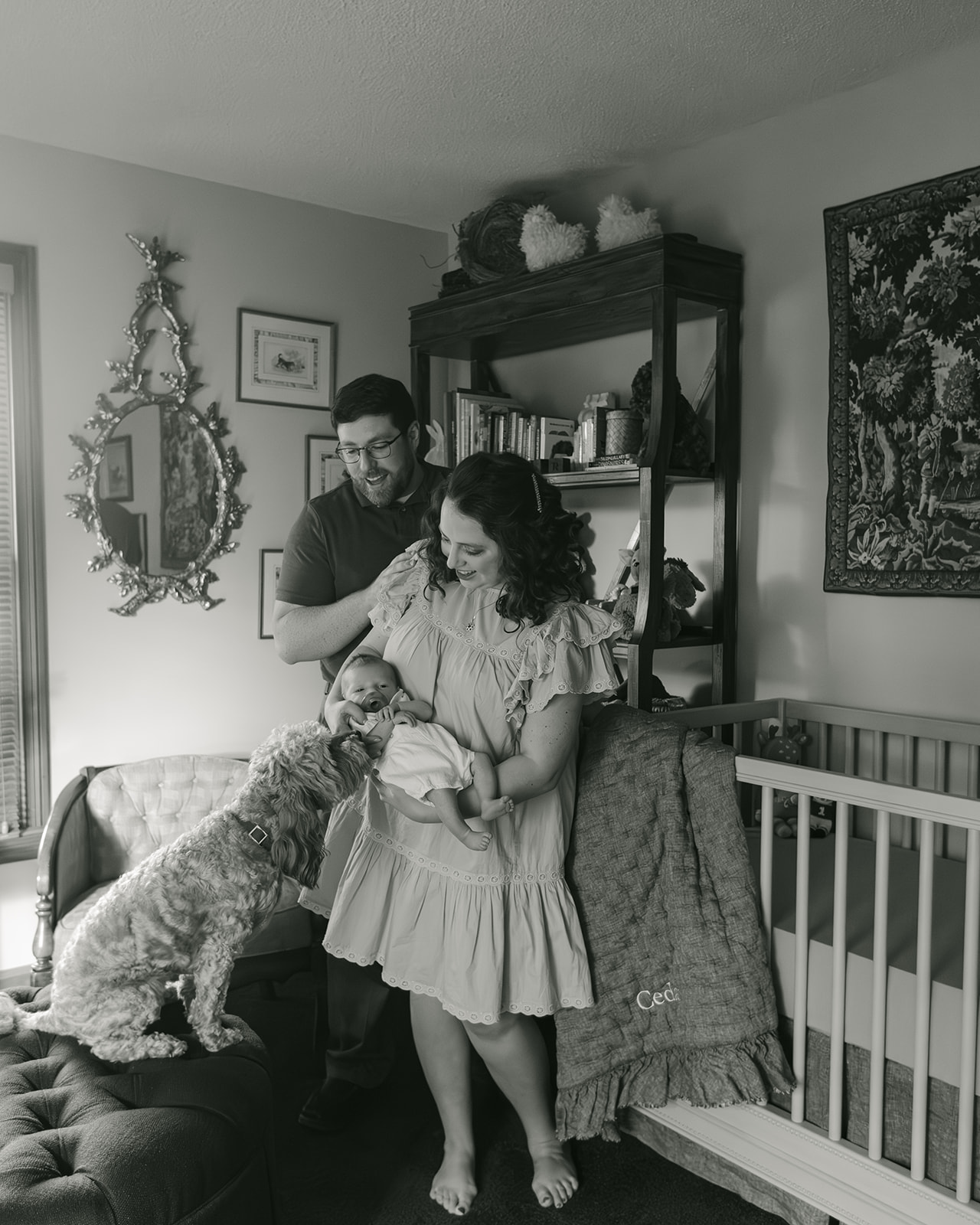 parents with newborn baby boy backyard photo