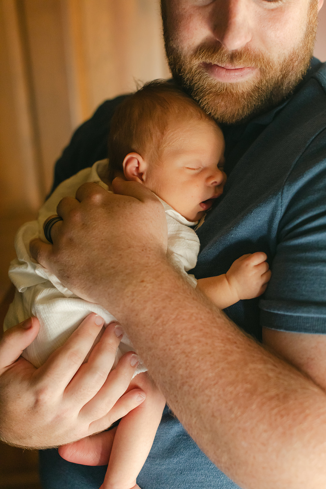 newborn baby boy on dad's chest