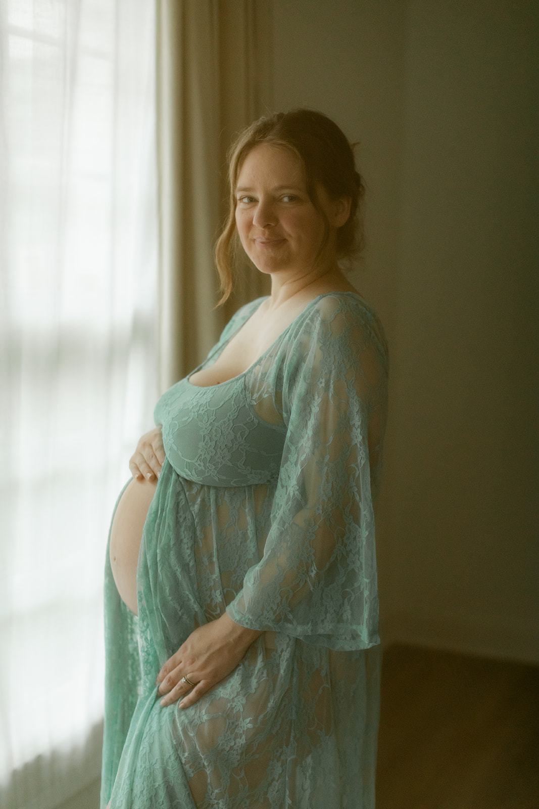 woman in turquoise blue robe. solo maternity session