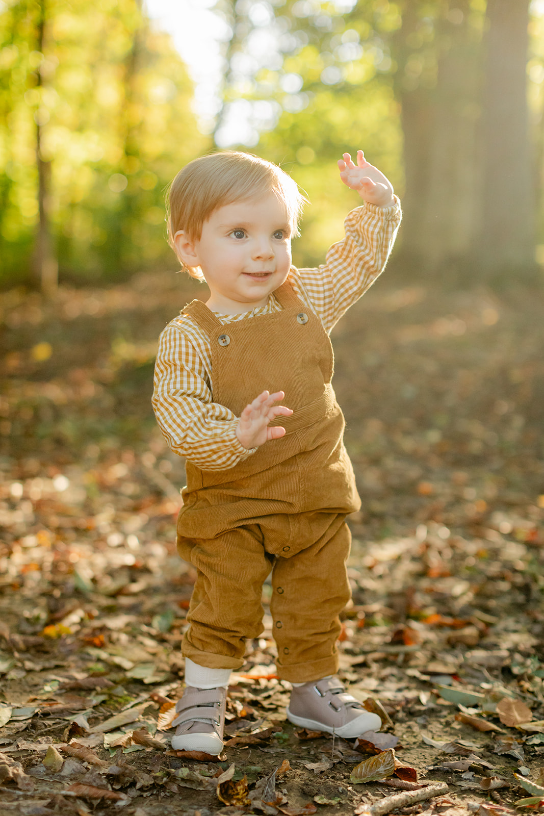 1 year old baby boy in overalls