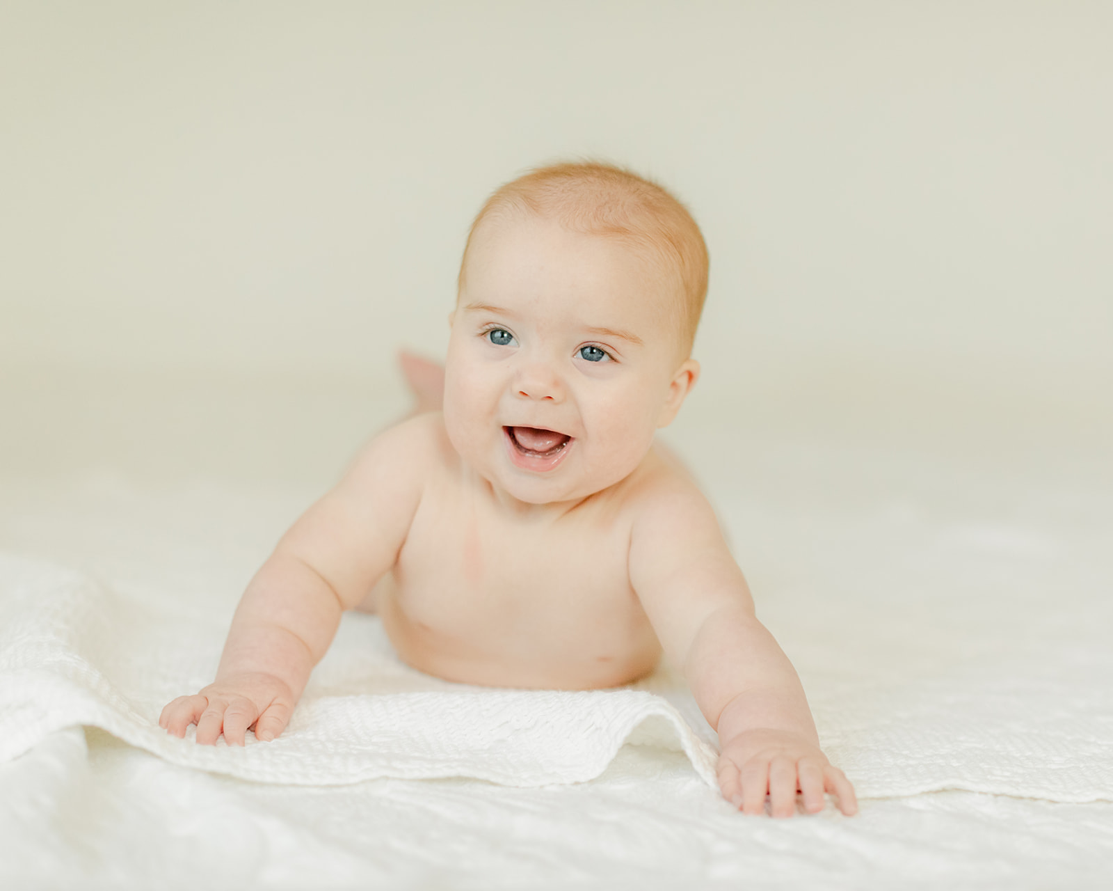 smiling 6 month old baby boy