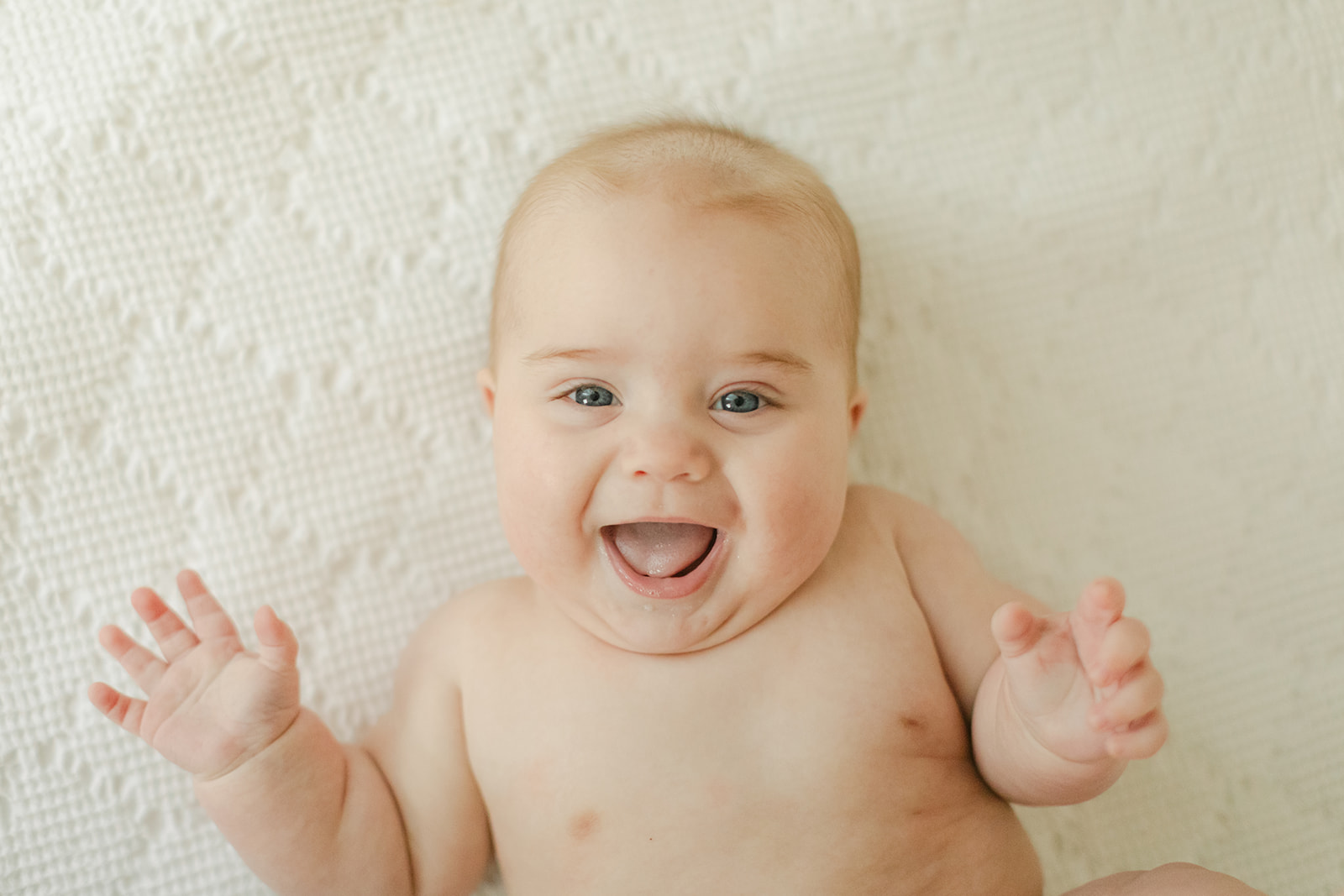 smiling 6 month old baby boy