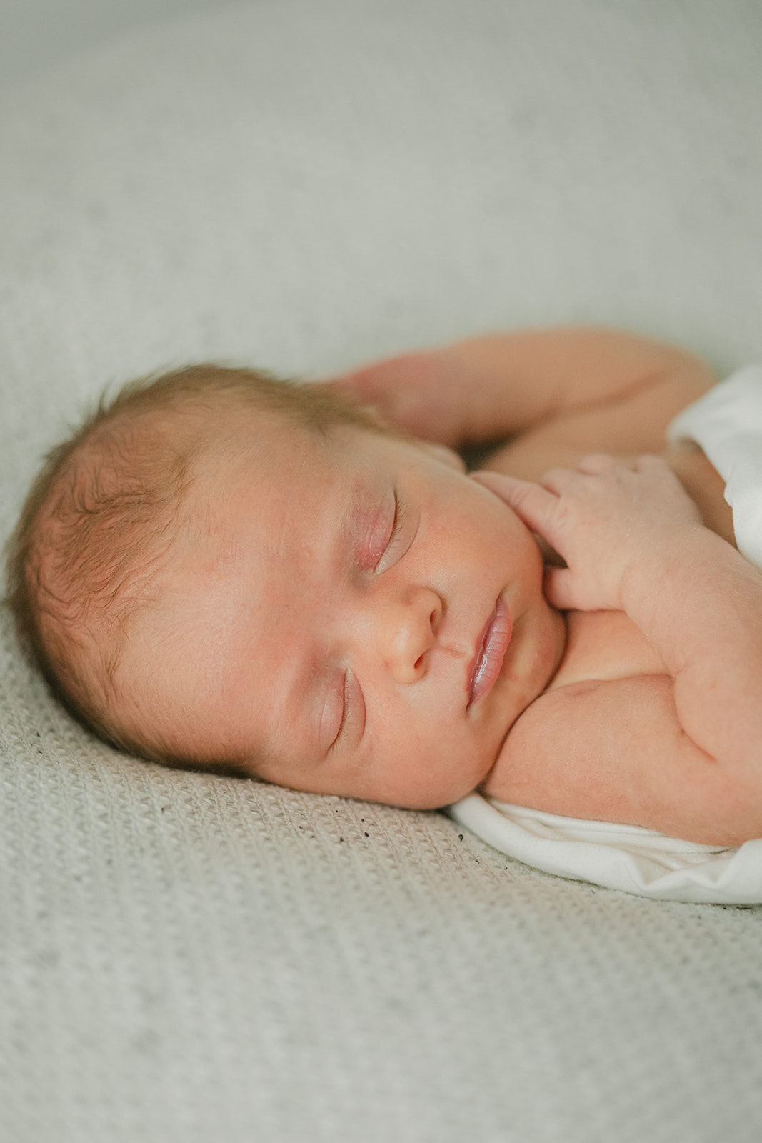 sleepy newborn baby boy