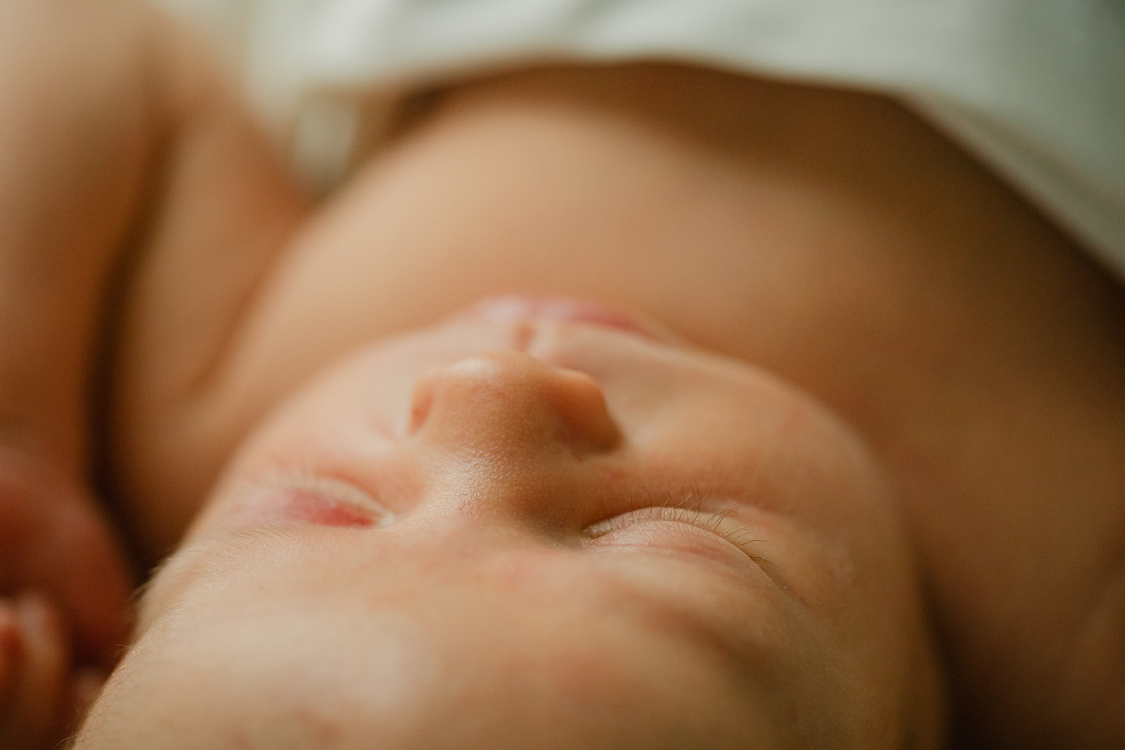 sleepy newborn baby boy