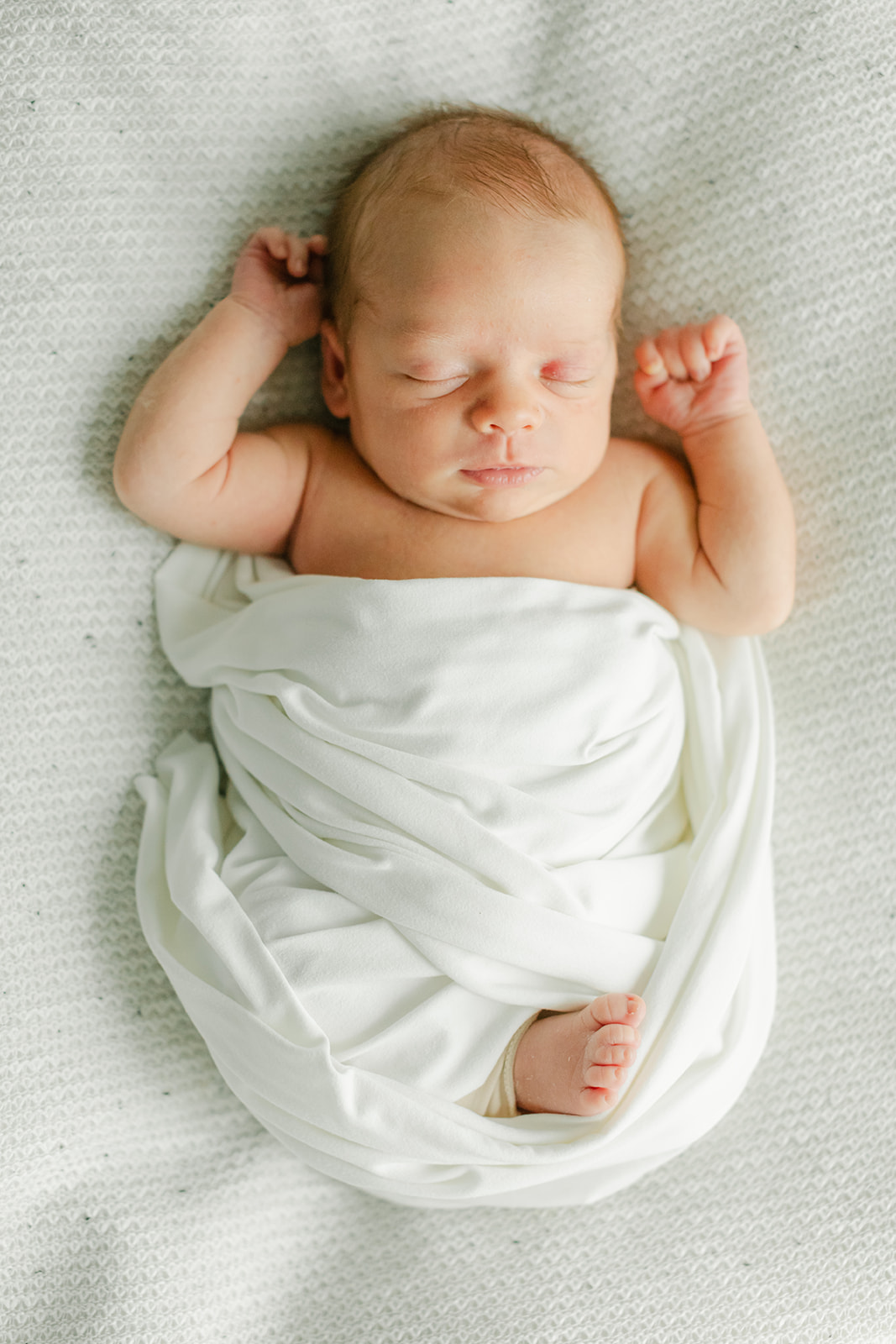 sleepy newborn baby boy