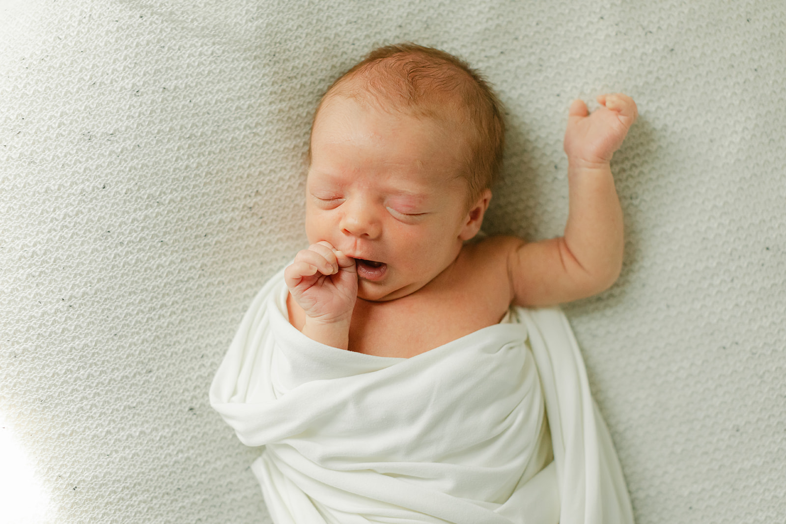 sleepy newborn baby boy