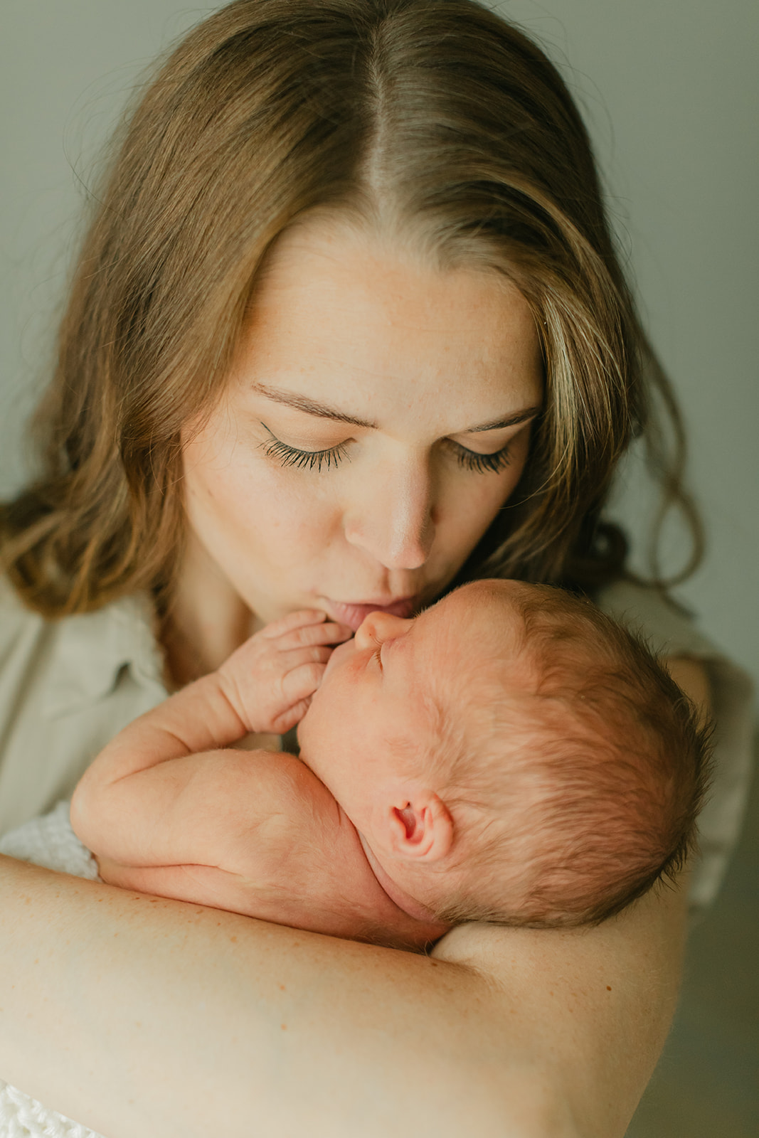 mama and sleepy newborn baby boy