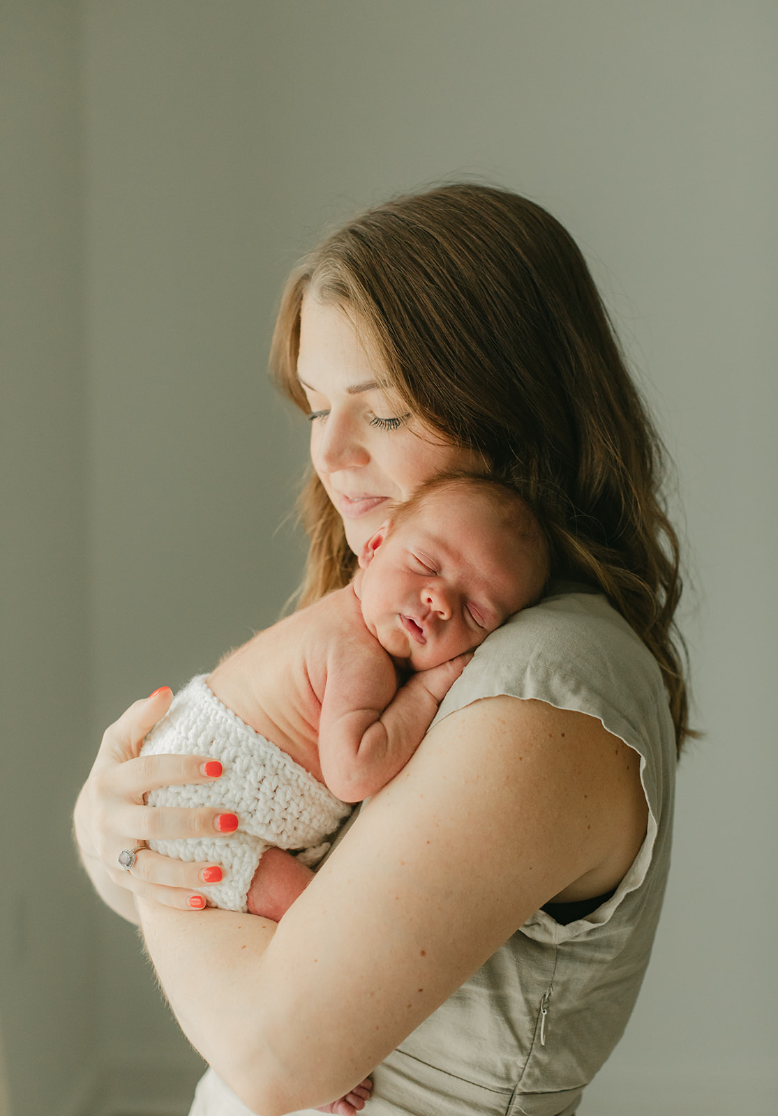 mama and sleepy newborn baby boy