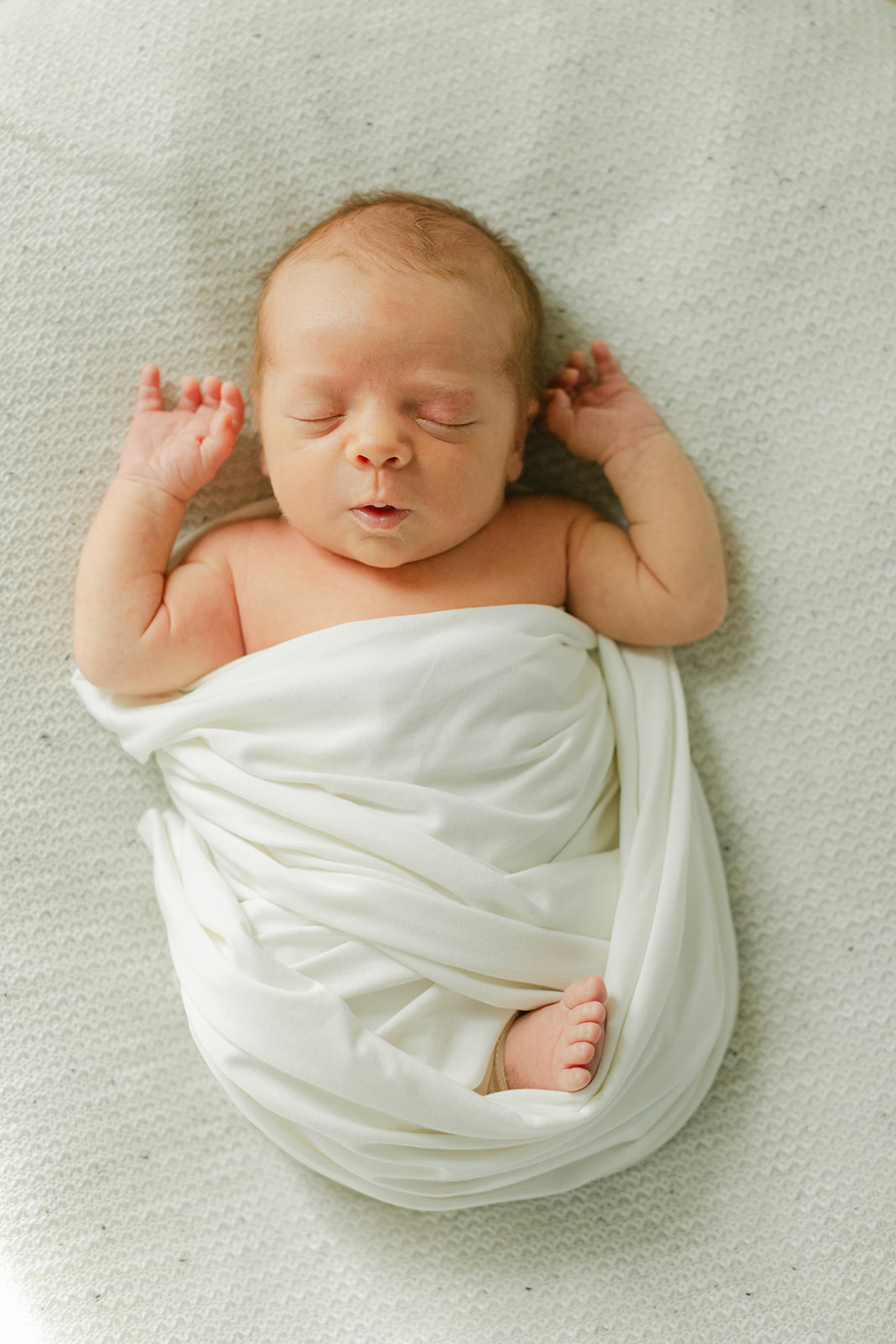 sleepy newborn baby boy
