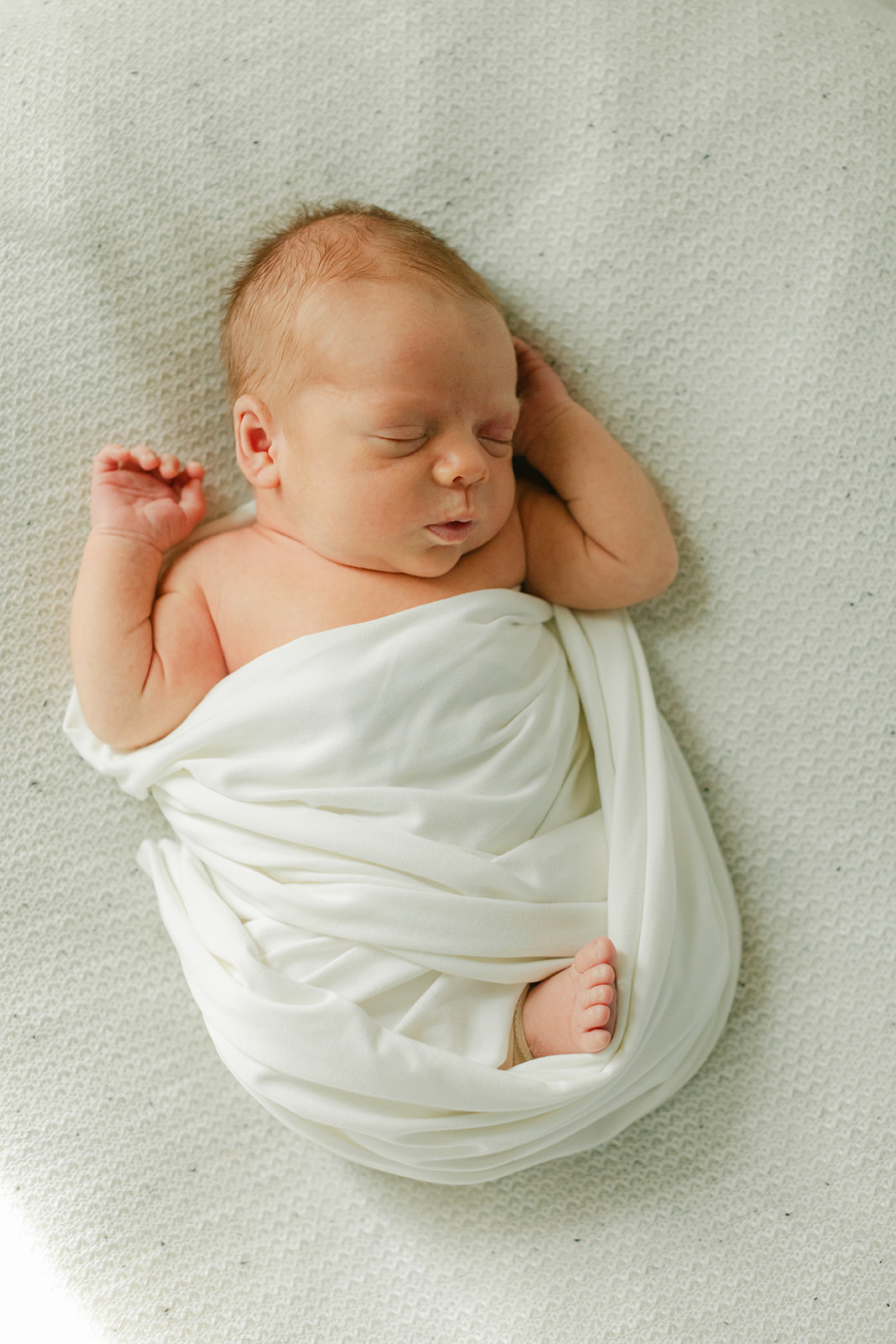 sleepy newborn baby boy