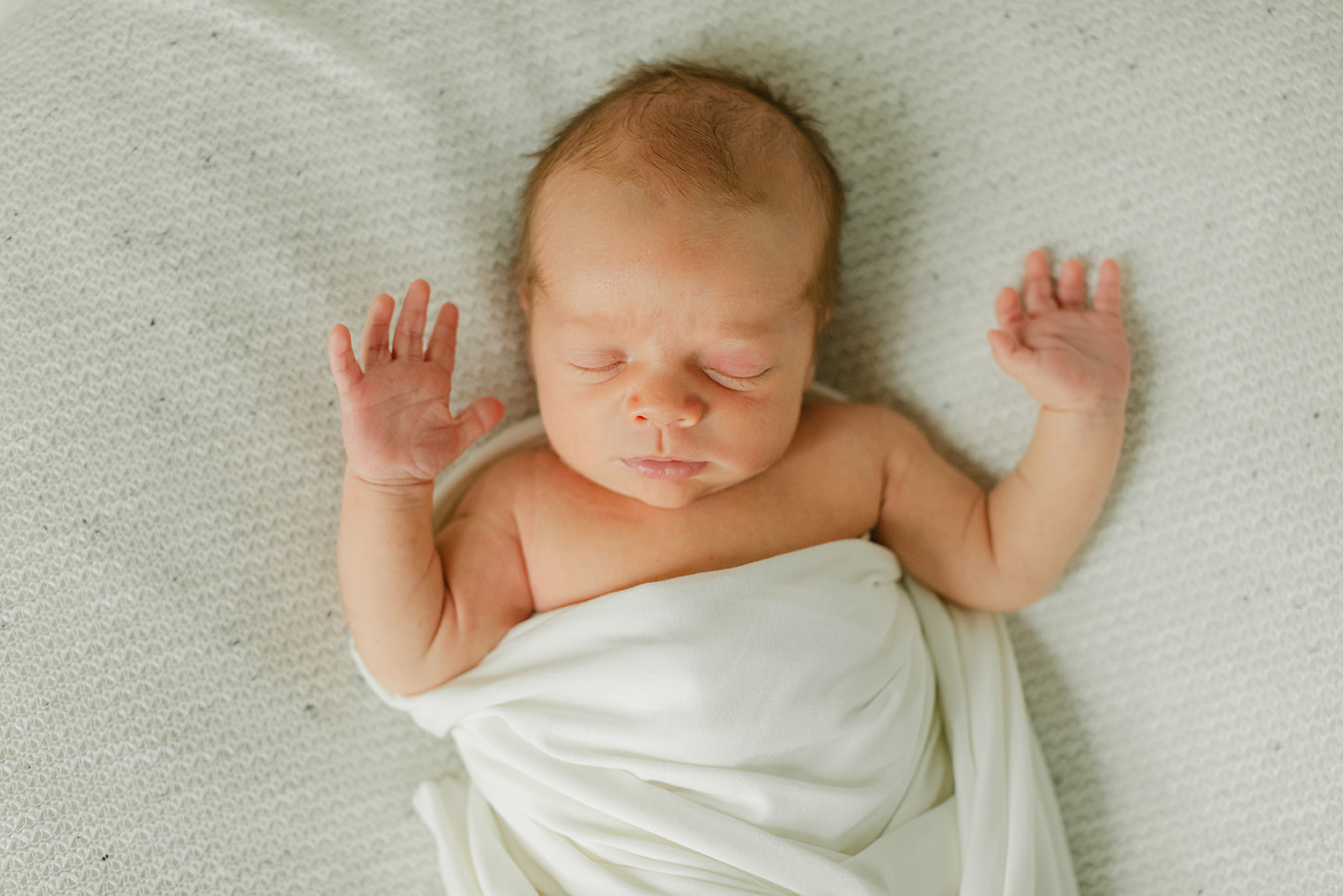 sleepy newborn baby boy