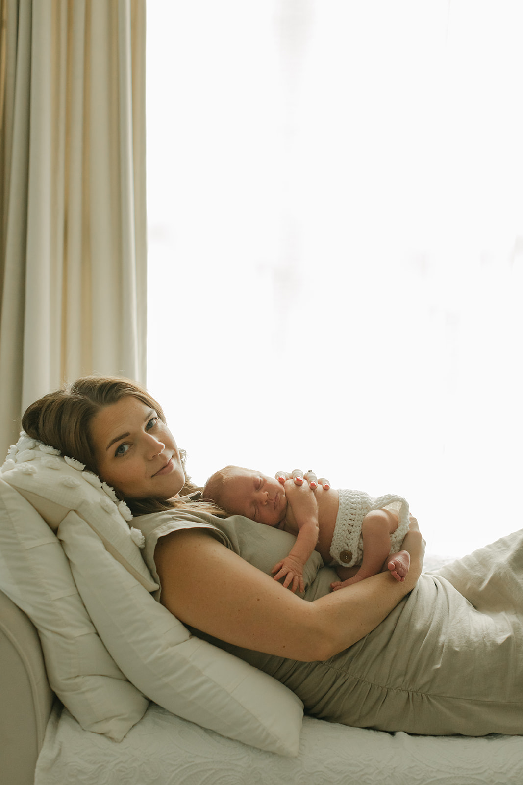 mama and sleepy newborn baby boy