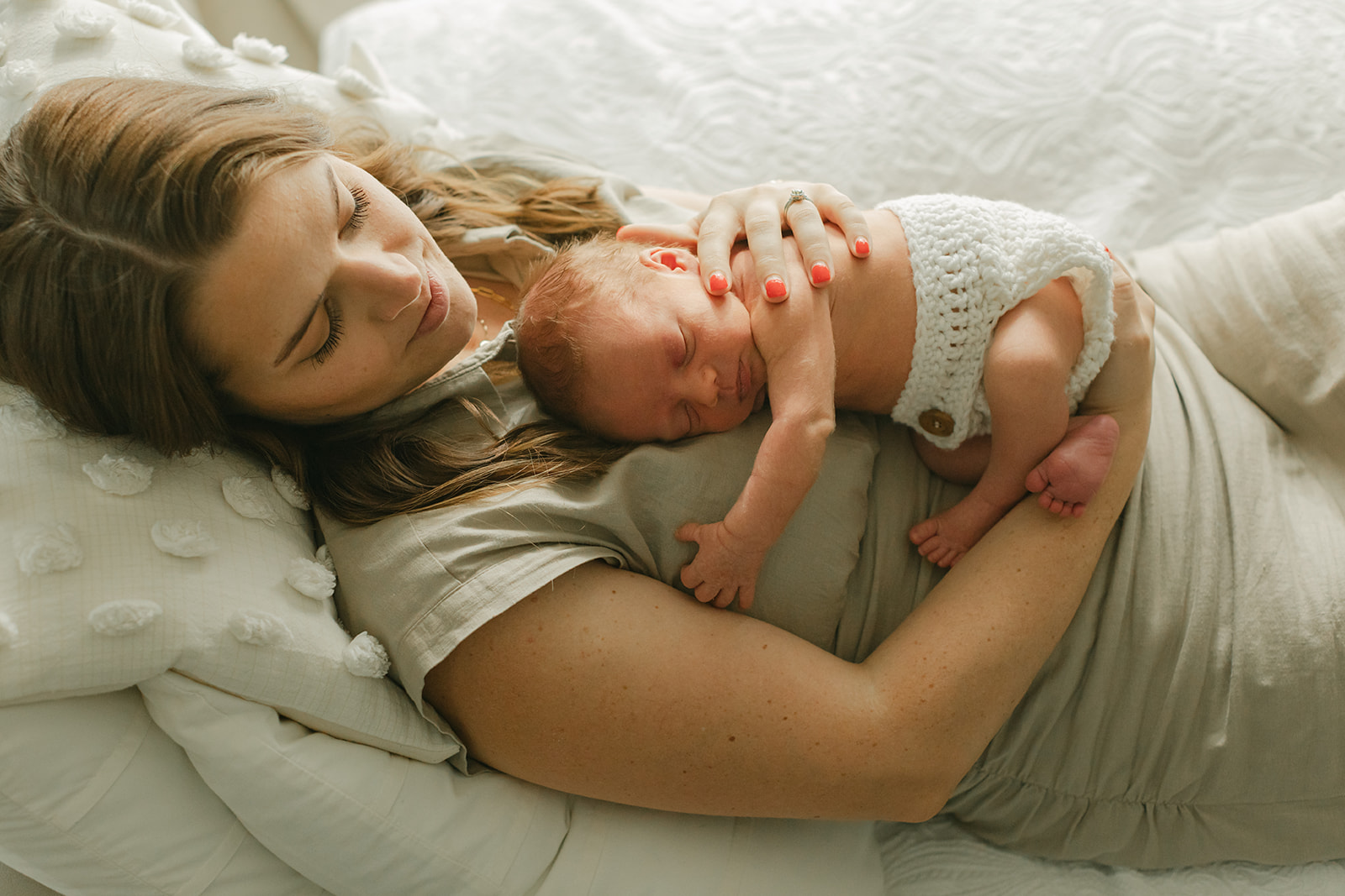 mama and sleepy newborn baby boy