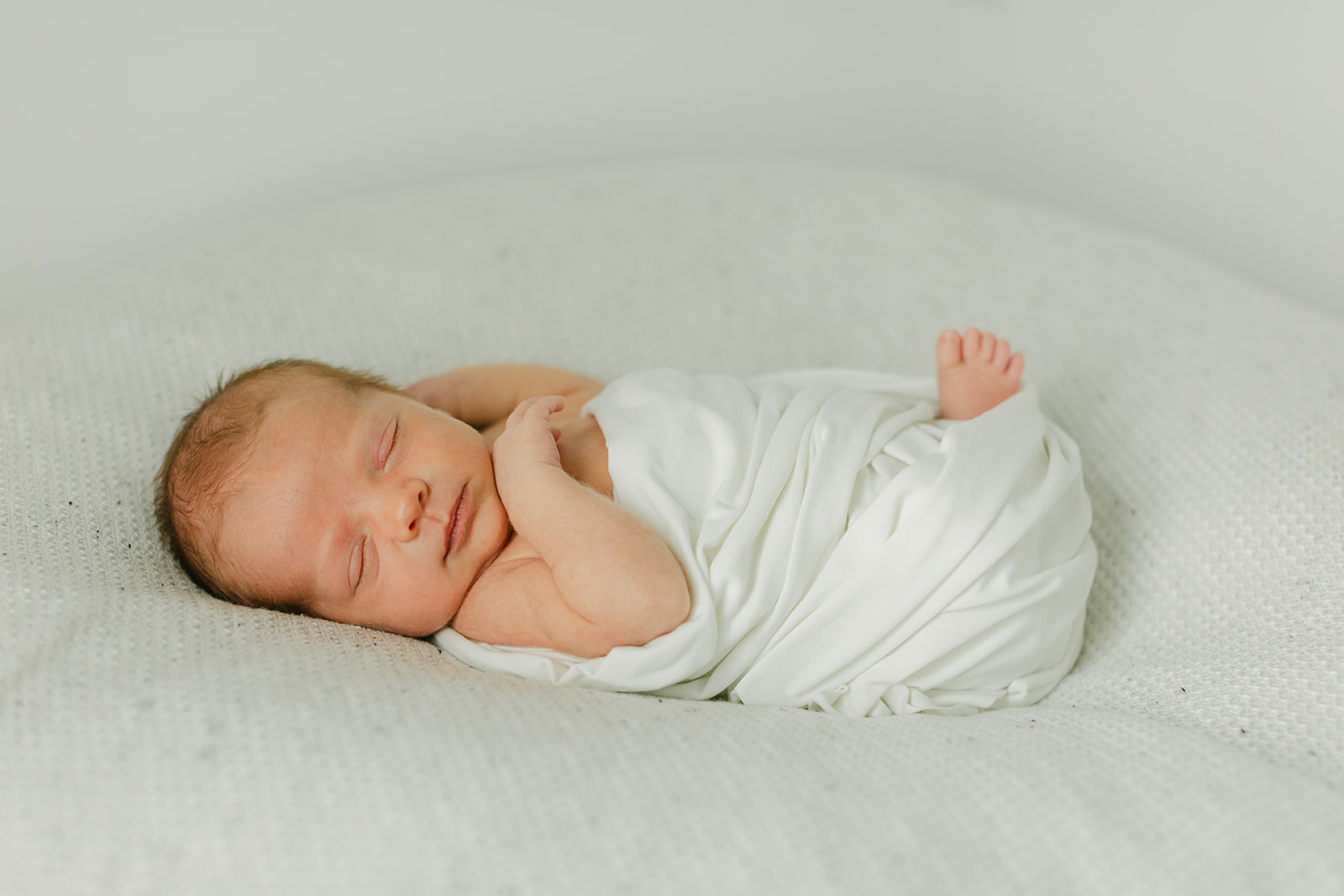 sleepy newborn baby boy