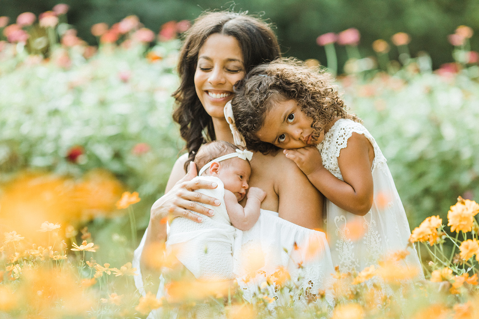 smiling mama with her two babies. garden photo sessions franklin tn