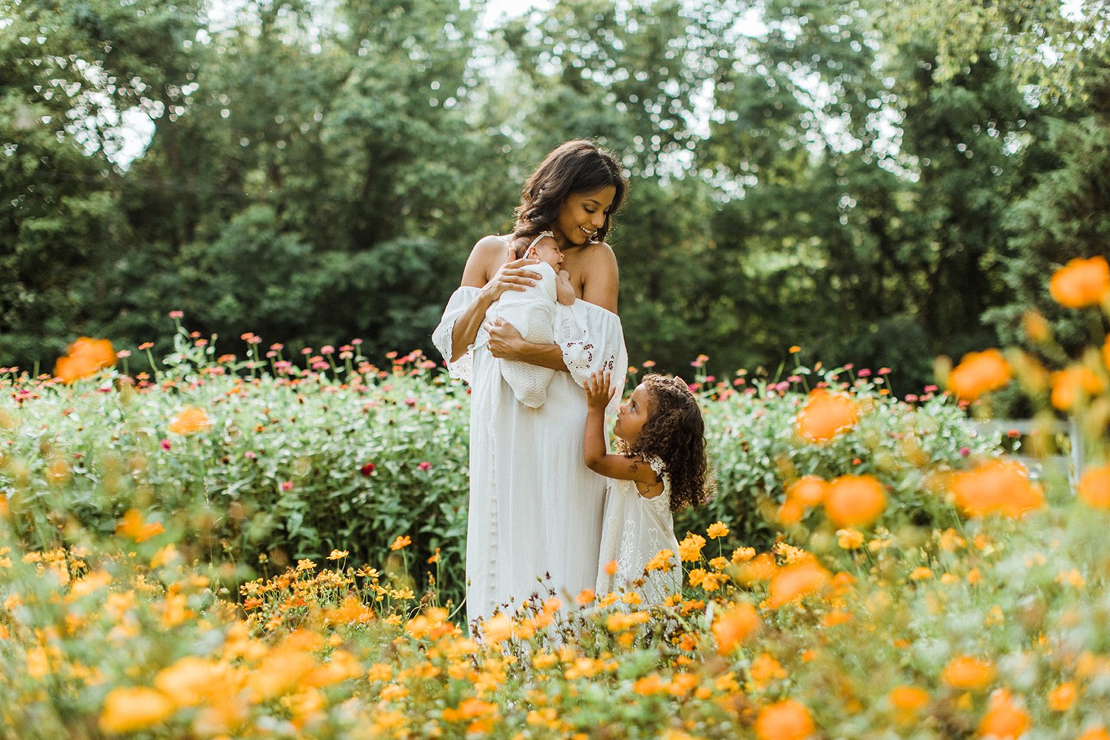 smiling mama with her two babies. garden photo sessions franklin tn