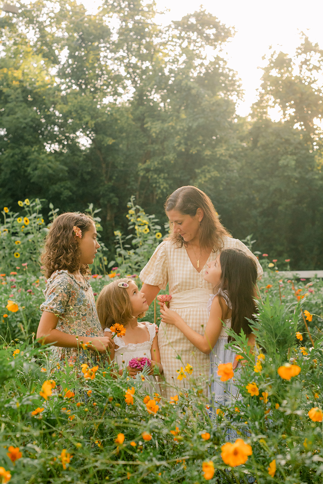 Family photo in garden (mama and her three girls)