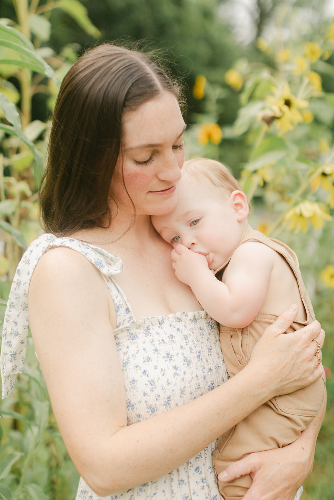 mama and baby boy in garden