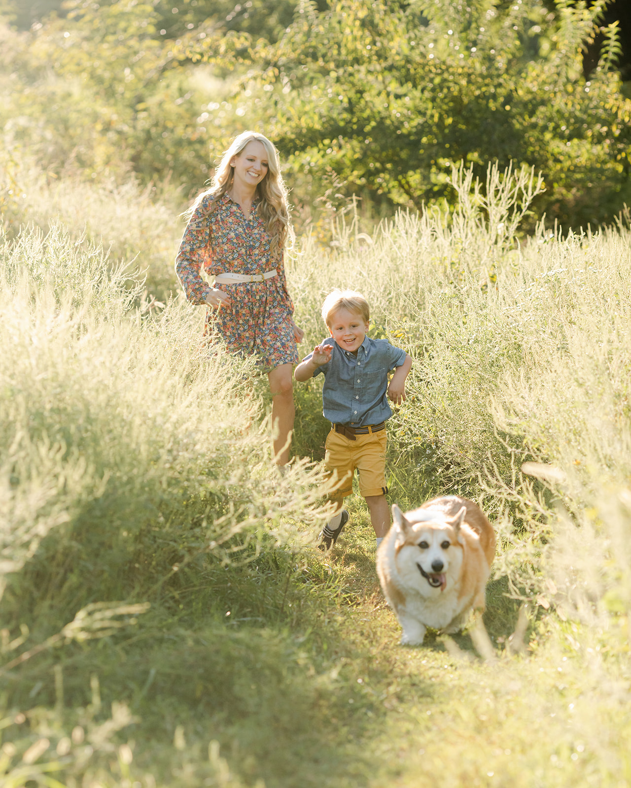 mama with her little boy and corgi