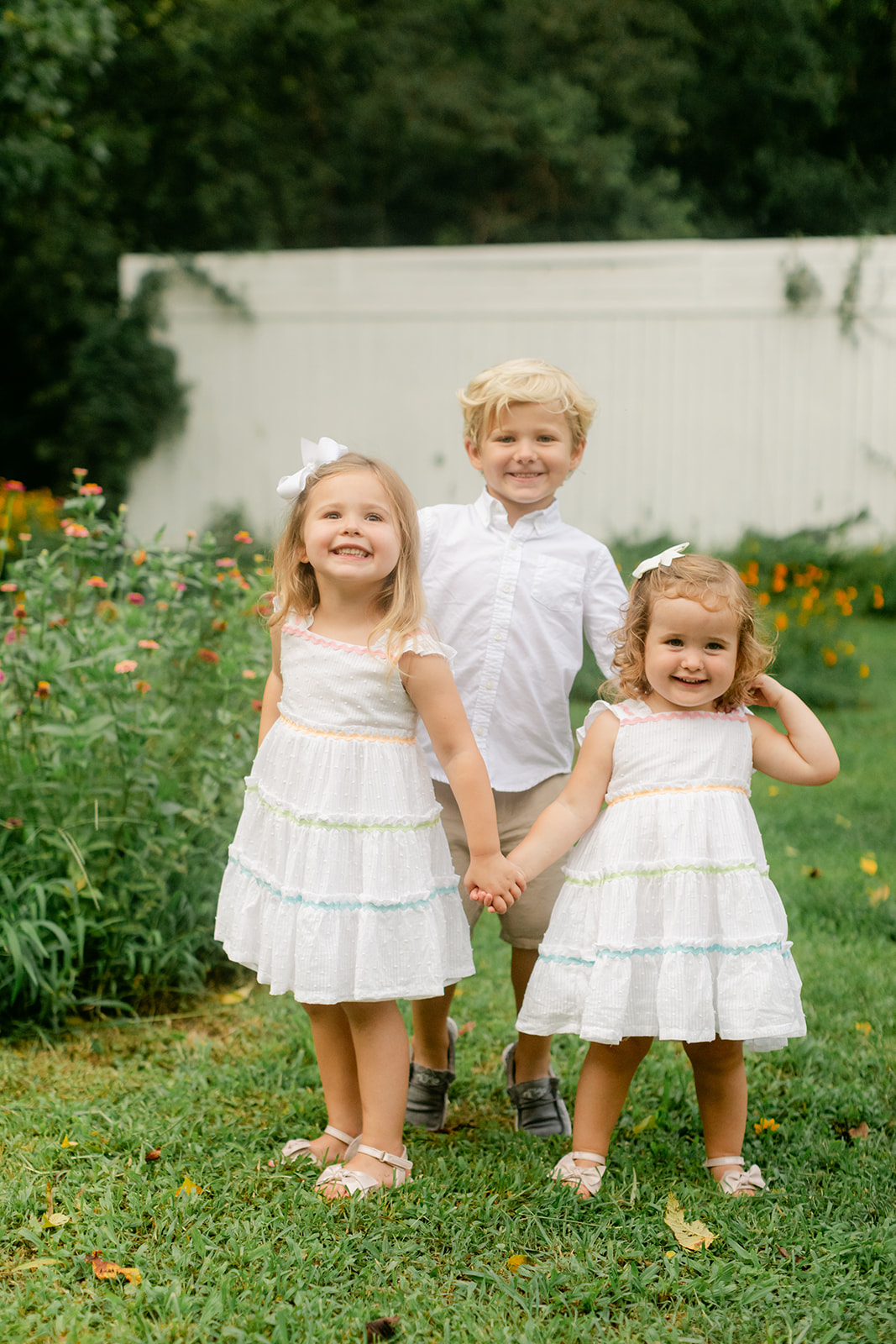 three siblings in garden. garden photo sessions franklin tn