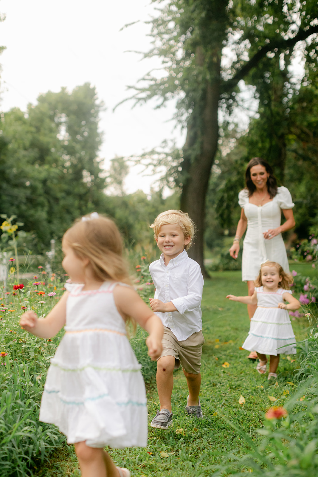 little kids running around in garden