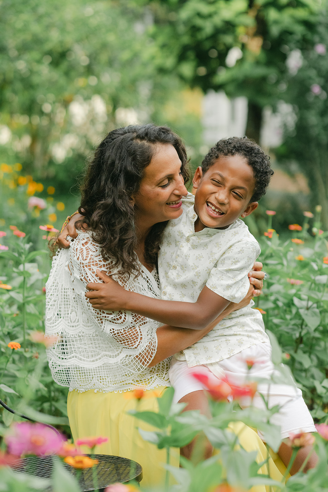 mama and son in flower garden