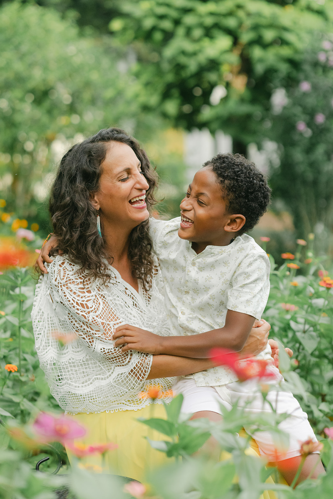 mama and son in flower garden