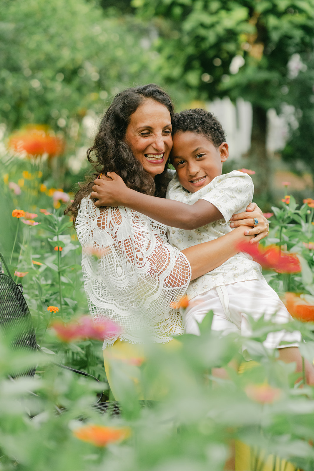 mama and son in flower garden