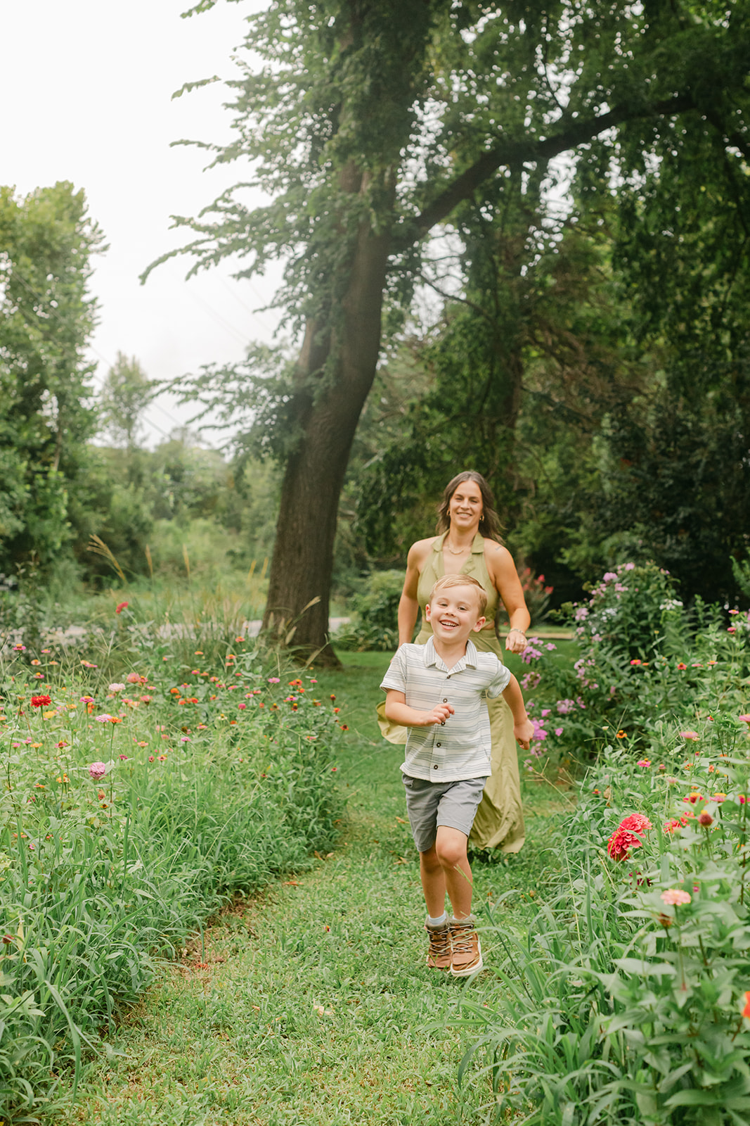 mama chasing son. garden photo 