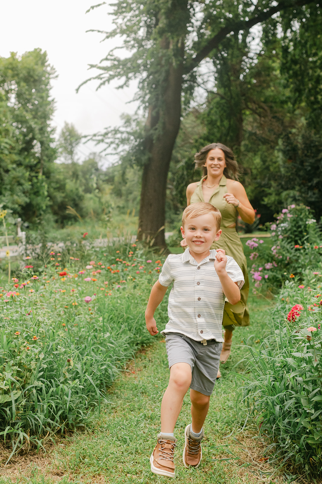 mama chasing son. garden photo 
