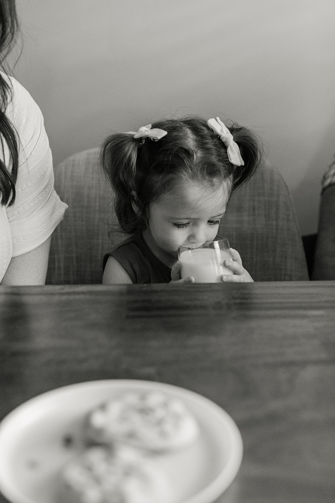 little girl drinking glass of milk
