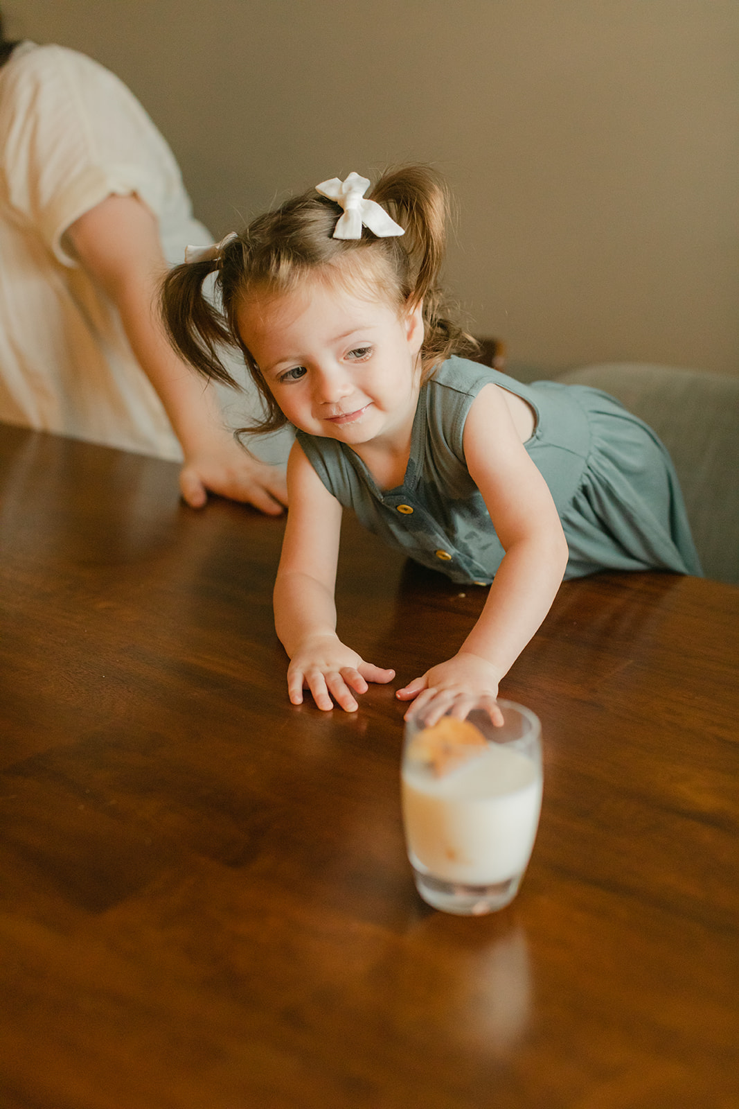 little girl with a glass of milk