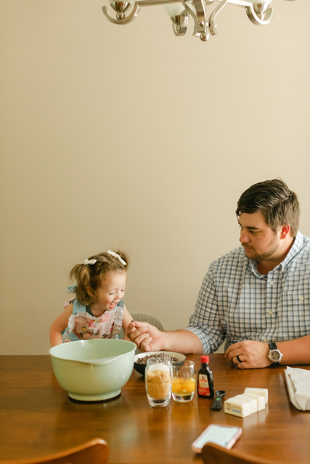 little girl baking with dad