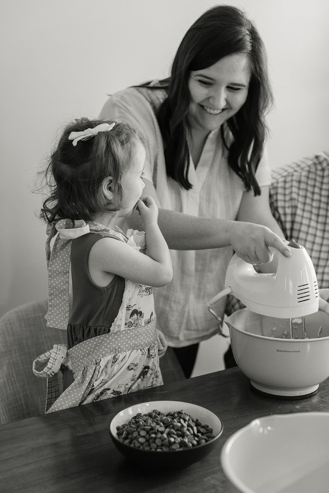 little girl baking with parents