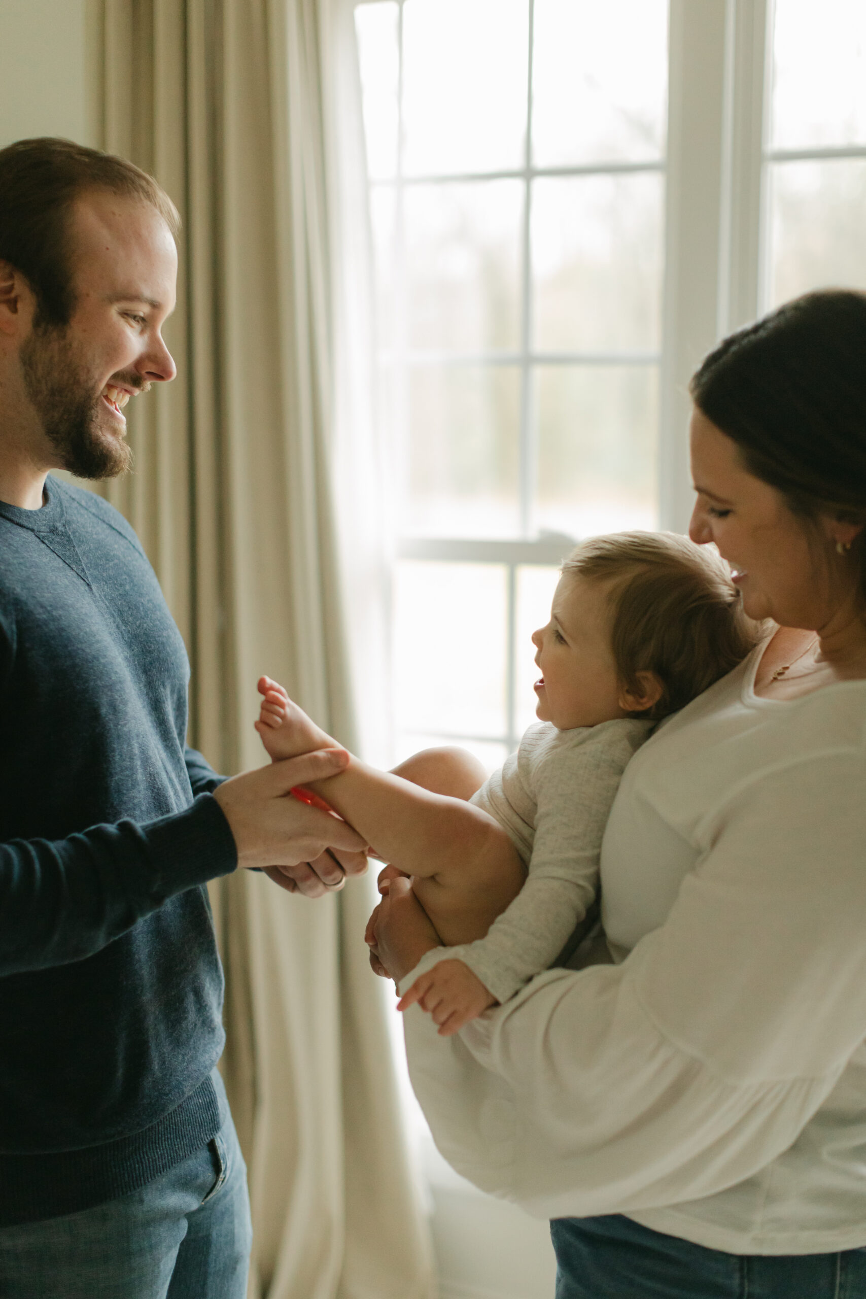 parents with 1 year old baby girl.
