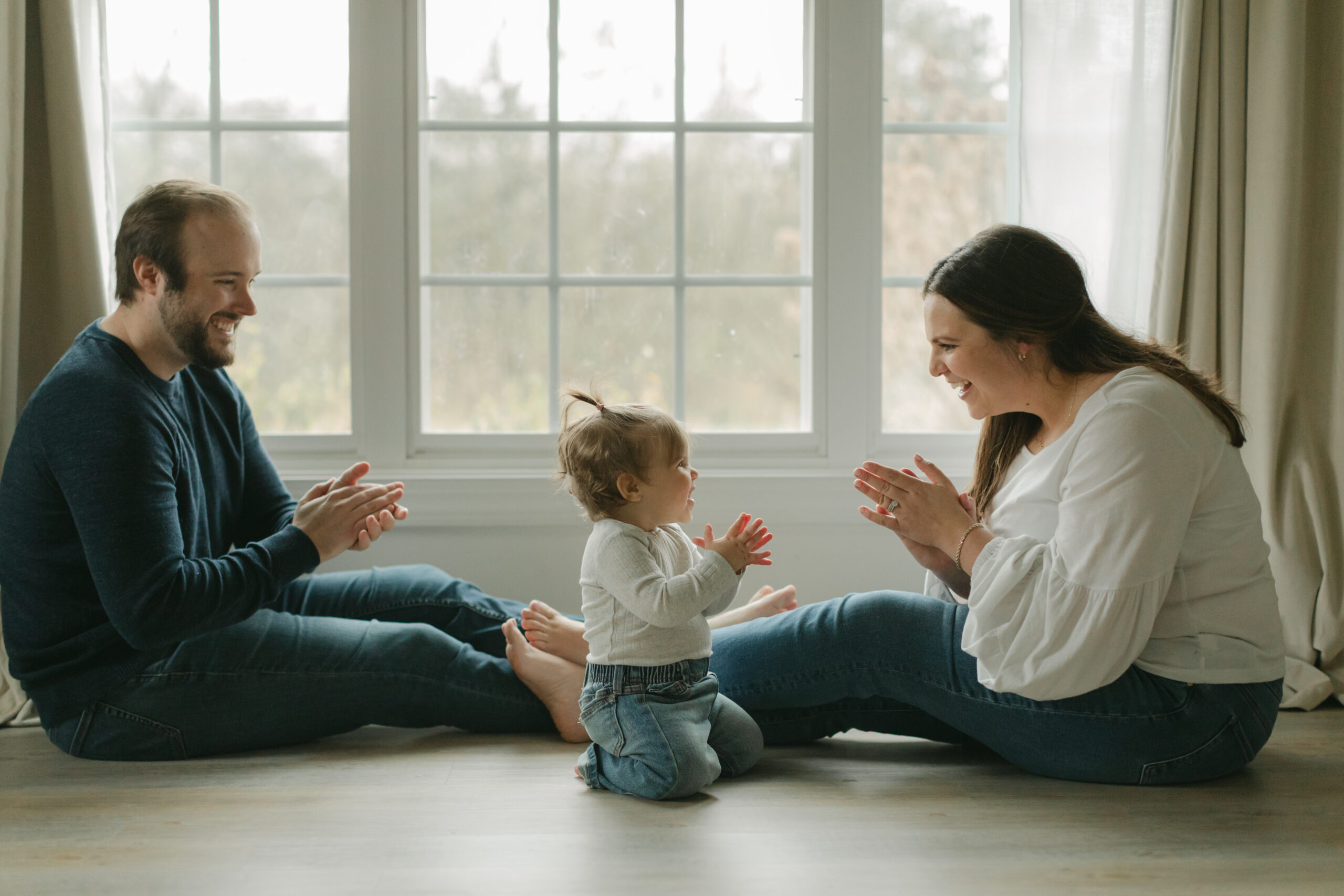 parents with 1 year old baby girl.