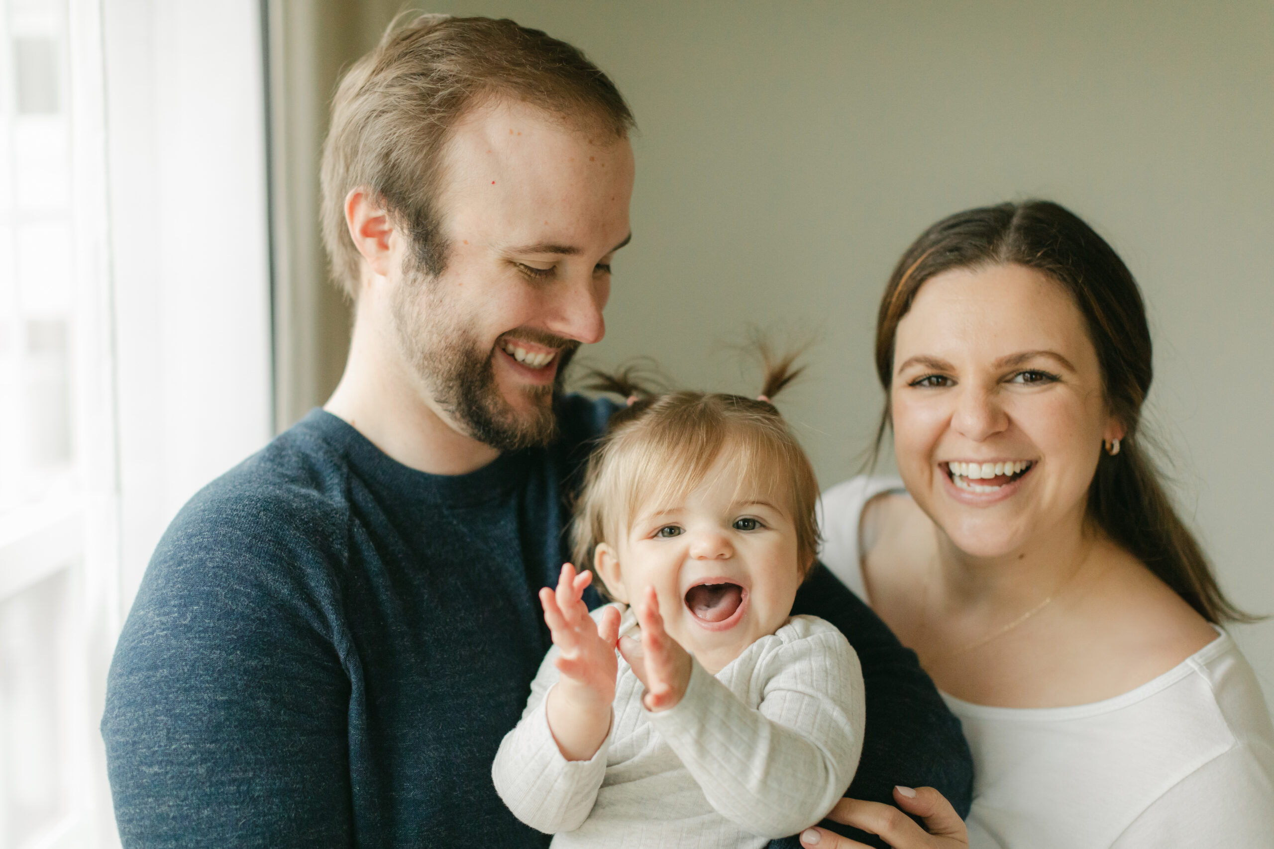 parents with 1 year old baby girl.